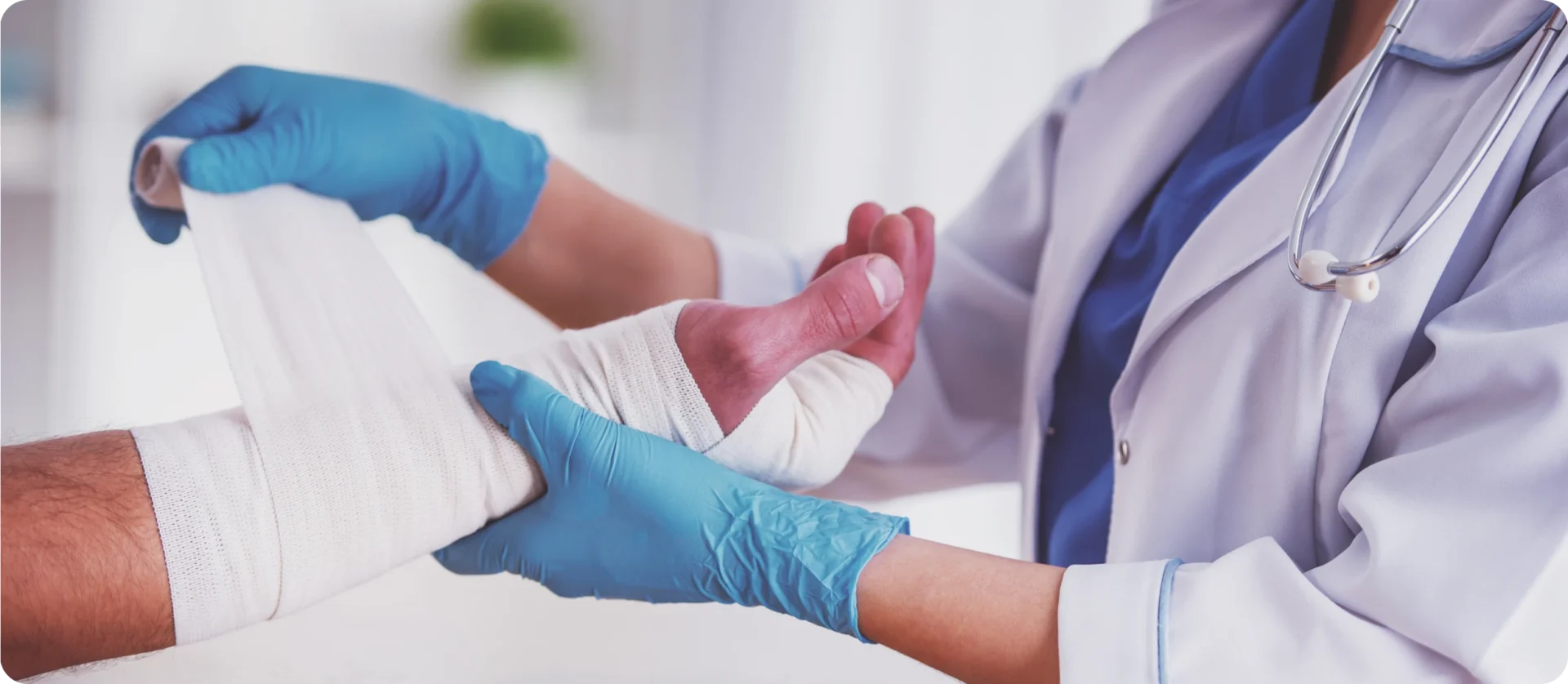 Healthcare worker applying foot bandage